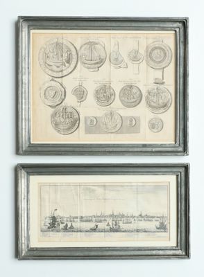 two framed drawings of boats and ships on a white wall