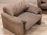a brown couch and a brown chair in a living room