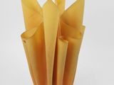 a yellow lamp that is sitting on a white table