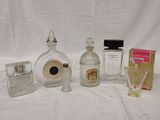 a lot of perfume bottles and a lighter on the table