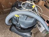 an image of a vacuum cleaner in a garage