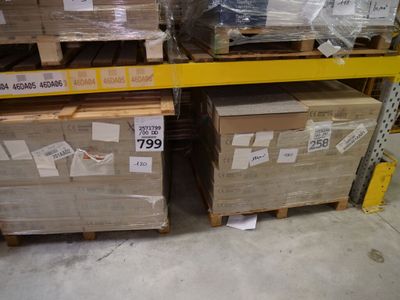 many boxes that are stacked on a shelf in a store