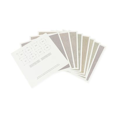 a lot of papers and a keyboard on a white surface