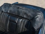 a close up of a black leather seat in a car