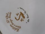 a close up of a plate with a bird on it