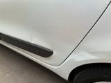 a close up of a car door handle with a sticker on it