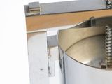 a machine that has some screws on the side of it