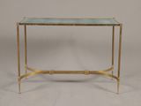 a brass and glass console table