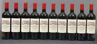 six bottles of red wine lined up in a row on a table