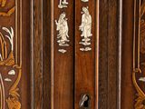 a close up of a wooden cabinet with carvings on it
