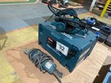 a blue machine that is sitting on a table