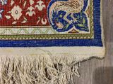 a close up of a rug on a wooden floor