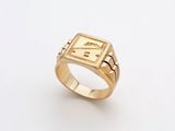a gold ring with a roman numeral on it