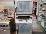 two ovens that are stacked on top of each other in the kitchen