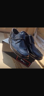 a pair of shoes that are on top of a box