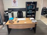 a desk with a phone and a printer on it