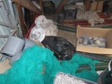 a pile of fishing nets and other items in a garage