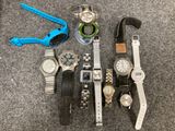 many different types of watches sitting on the floor