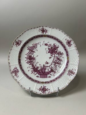 purple and white plate with a floral design on the rim