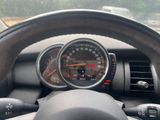 a dashboard with a speedometer and a steering wheel