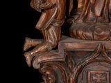 a statue of a woman holding a child on top of a table