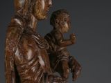 an image of a statue of a woman holding a child