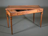 an old wooden desk with a drawer on top of it