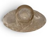 a glass bowl with a lid on a white surface