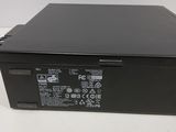 a close up of a black electronic device on a white surface