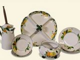 a picture of a table setting with lemons painted on it