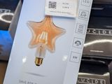 a light bulb sitting on top of a pile of boxes
