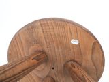 a wooden object with a sticker on the top of it