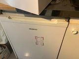 a box on top of a dishwasher in a kitchen