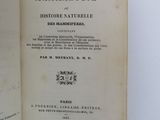an open book with a picture of a man in a hat on top of it