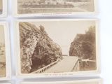 several old postcards of a road with a mountain in the background