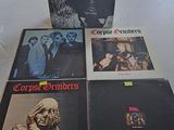 three copies of copies of copies of the beatles album are on a table