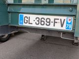 a green truck with a sign that says gl 359 fv on it