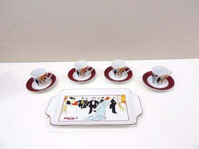 five cups and saucers sitting on a tray on a table