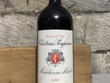 a bottle of wine that is sitting on a table