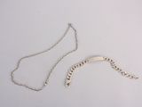 silver plated necklace and bracelet with a curved design on a chain