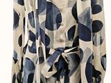 an image of a woman ' s dress with a blue and white pattern