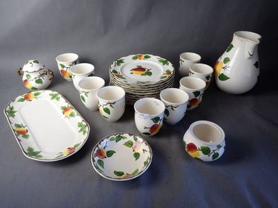 a lot of dishes and cups that are on the table