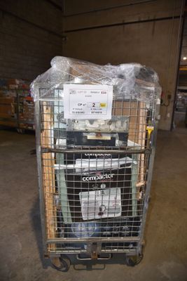a cart with a lot of items in it in a warehouse