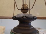 a lamp that is sitting on a table with a lamp shade on it