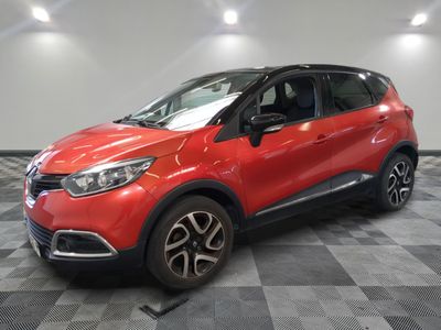 a red renault c - cross parked on a checkered floor
