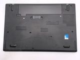 a close up of a black laptop with a blue sticker on it