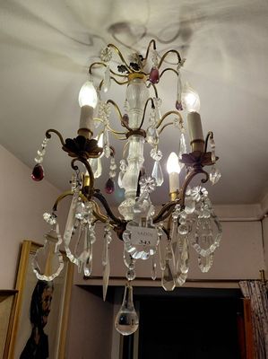 a chandelier hanging from the ceiling in a room
