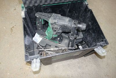 a tool in a case that is sitting on the floor