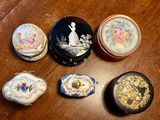 many different types of decorative boxes on a table