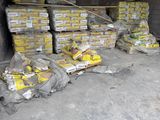 many bags of food sitting in a storage area